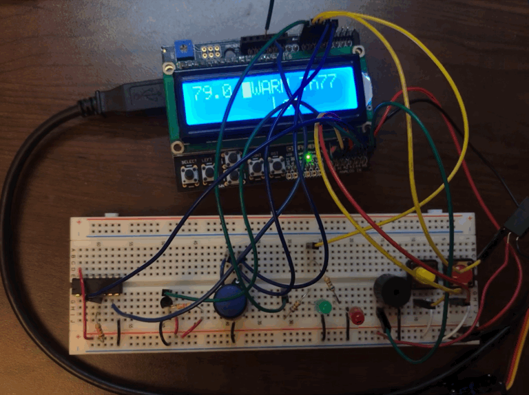 Arduino and circuit board, with red LED blinking